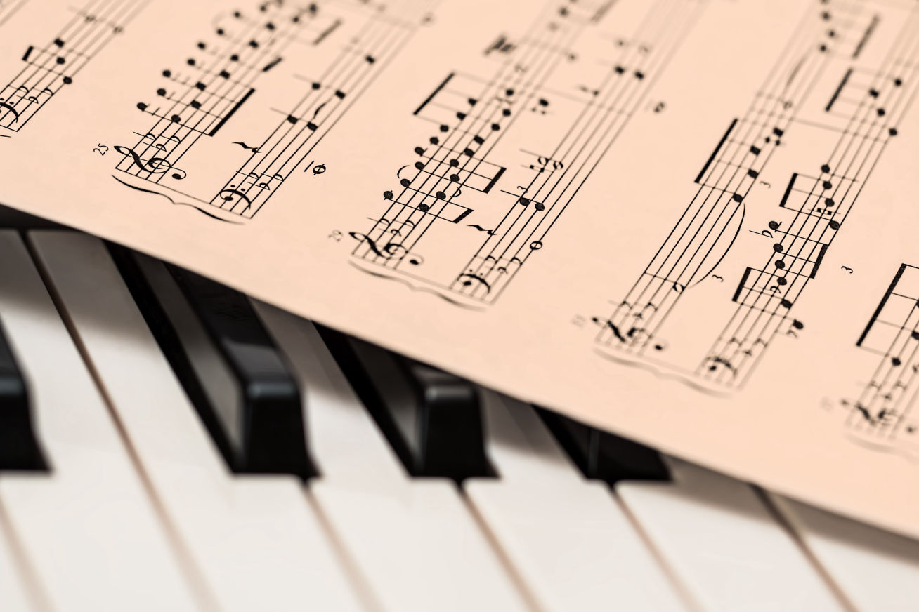 Photo of piano music on a keyboard